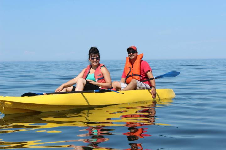 a person with a yellow boat in the water